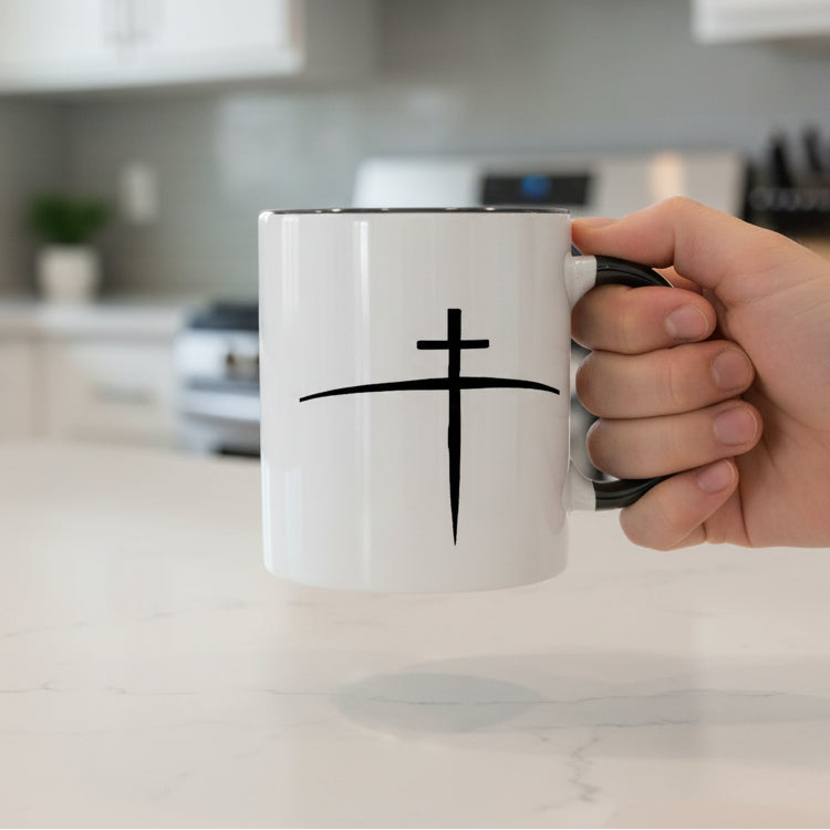 White mug with black cross design on a white background