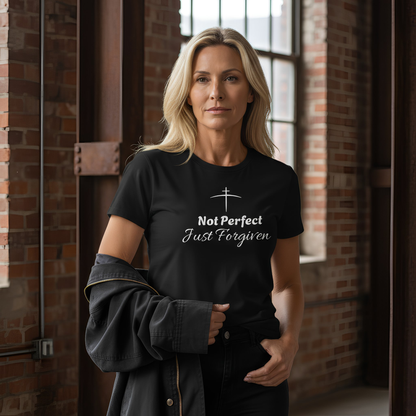 Woman wearing a black t-shirt with text in an industrial setting