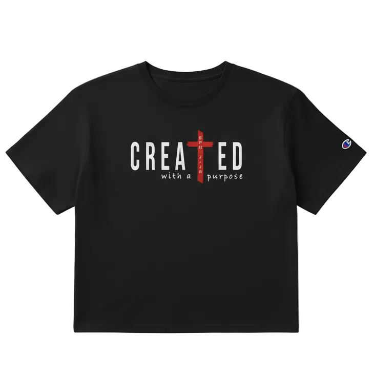 Black t-shirt with 'CREATED with a purpose' text and cross design on a light gray background